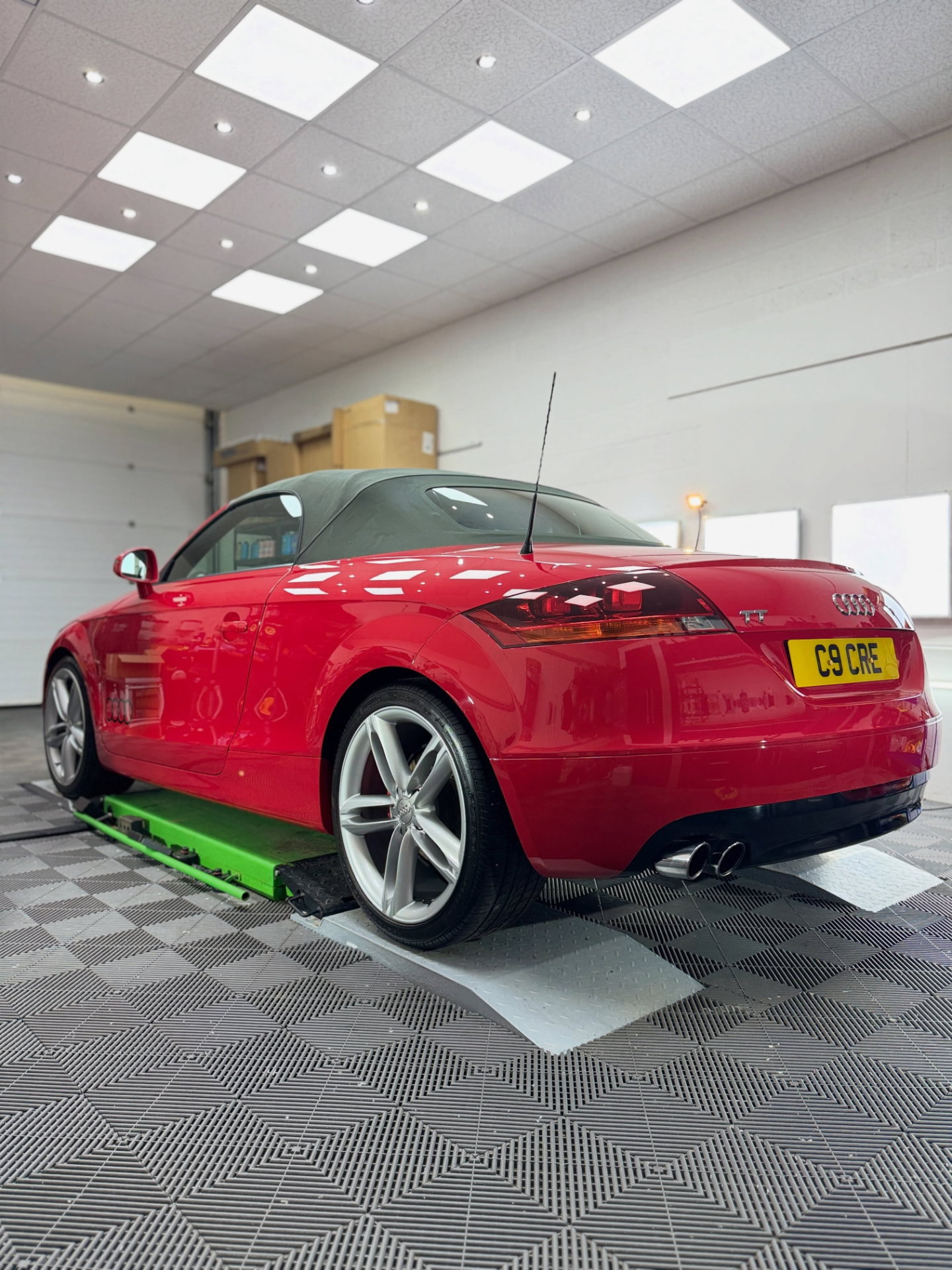 Red Audi TT inside the Ultra Gloss detailing studio