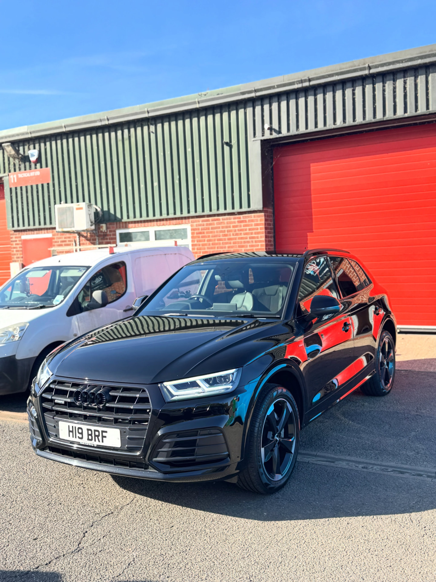 Black Audi Q5 outside the Ultra Gloss unit