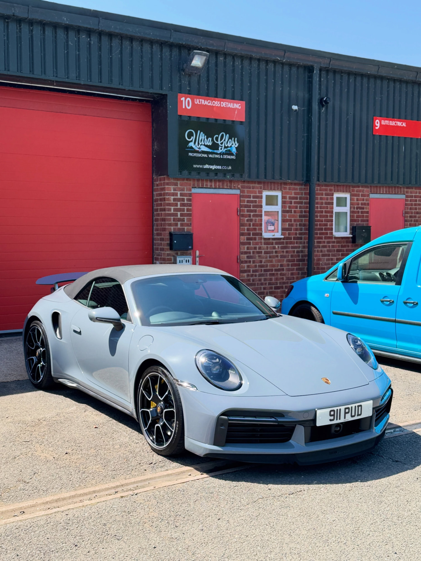 Silver Porsche outside the Ultra Gloss workshop