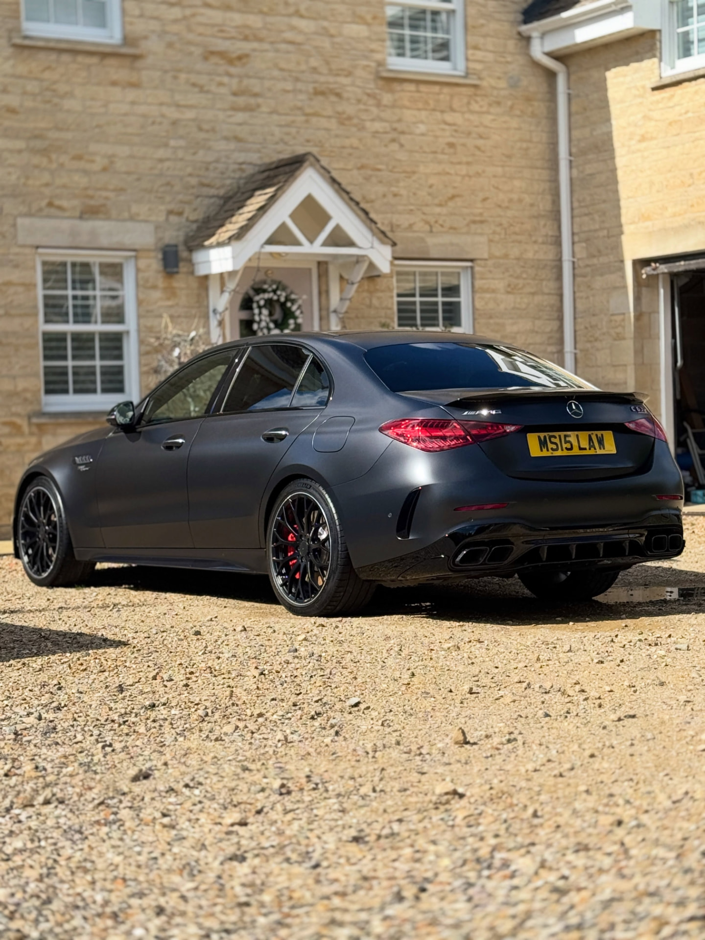 Satin grey Mercedes-AMG on a driveway